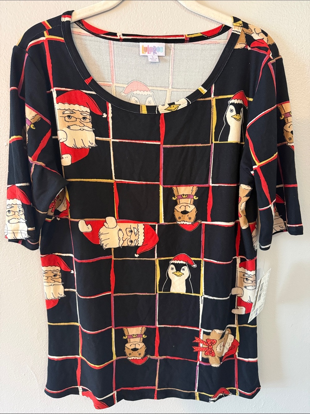 LuLaRoe Black Red Cream Holiday Santa & Penguin Grid Short Sleeve Top